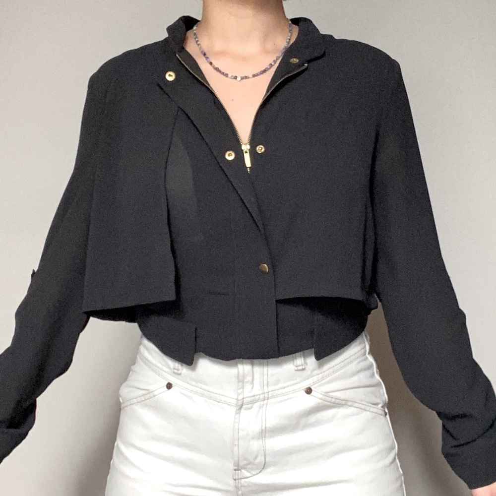 Statement soft black shirt featuring gold hardware